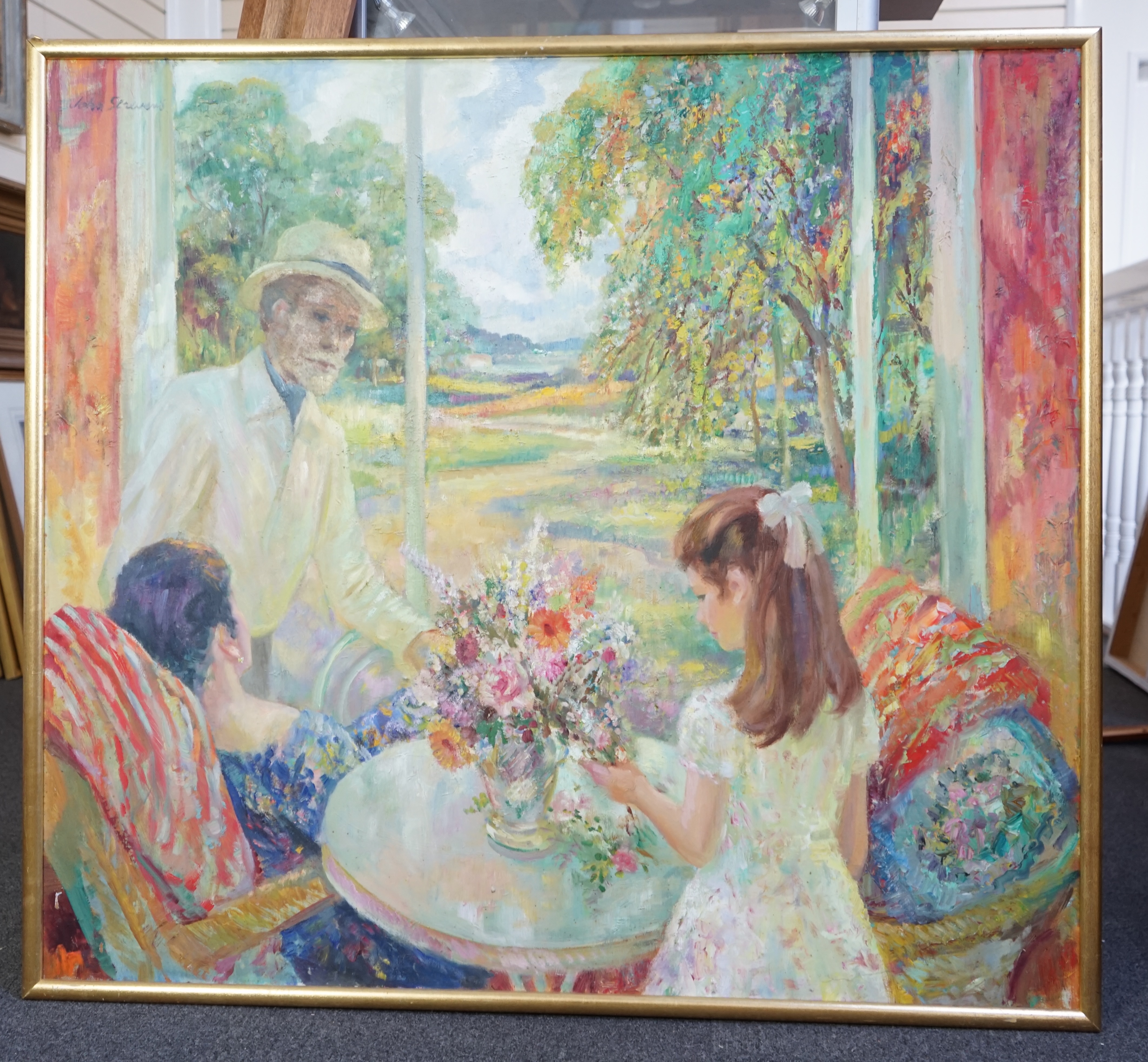 John Frederick Lloyd Strevens (British, 1902-1990), Portrait of the artist with his family overlooking a garden, oil on board, 100 x 111cm